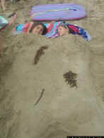 Megan and Emily in a sand bed