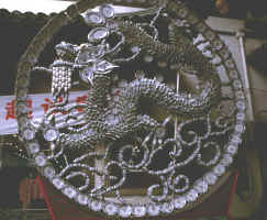 Dragon made of china: cups, spoons, dishes 