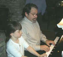 Fred and Ariel tickling the ivories